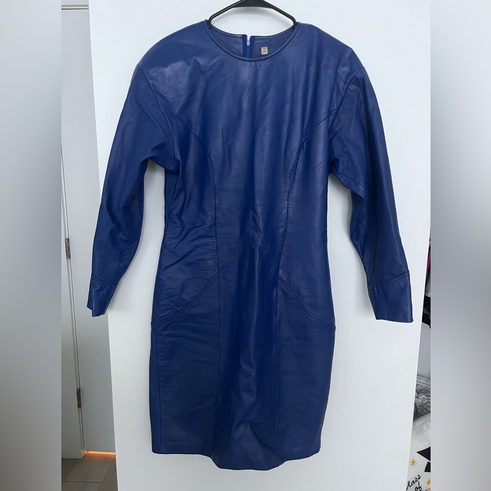 An 80s vintage Ambria leather midi dress. Blue, long sleeve, with shoulder pads.